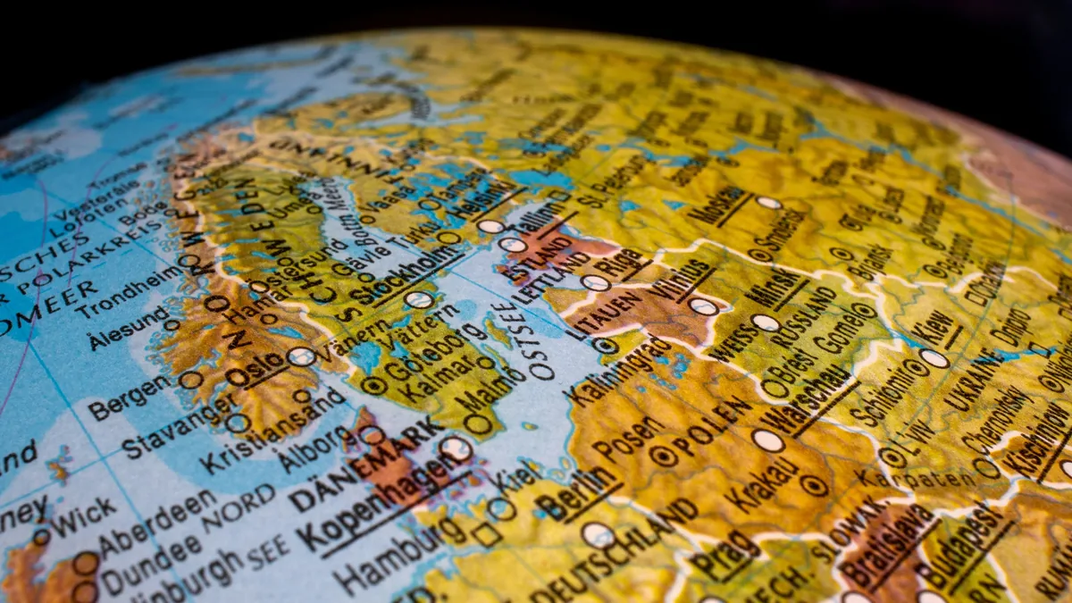 A close-up view of a globe, with the focus on the northern part of Europe, including the UK, Norway, Sweden, Denmark, and Germany.
